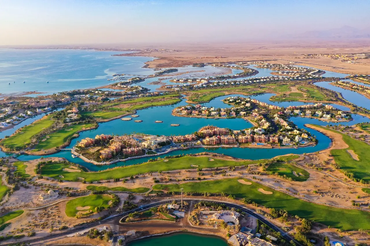 Aerial panorama of the El Gouna lagoons and desert at sunset