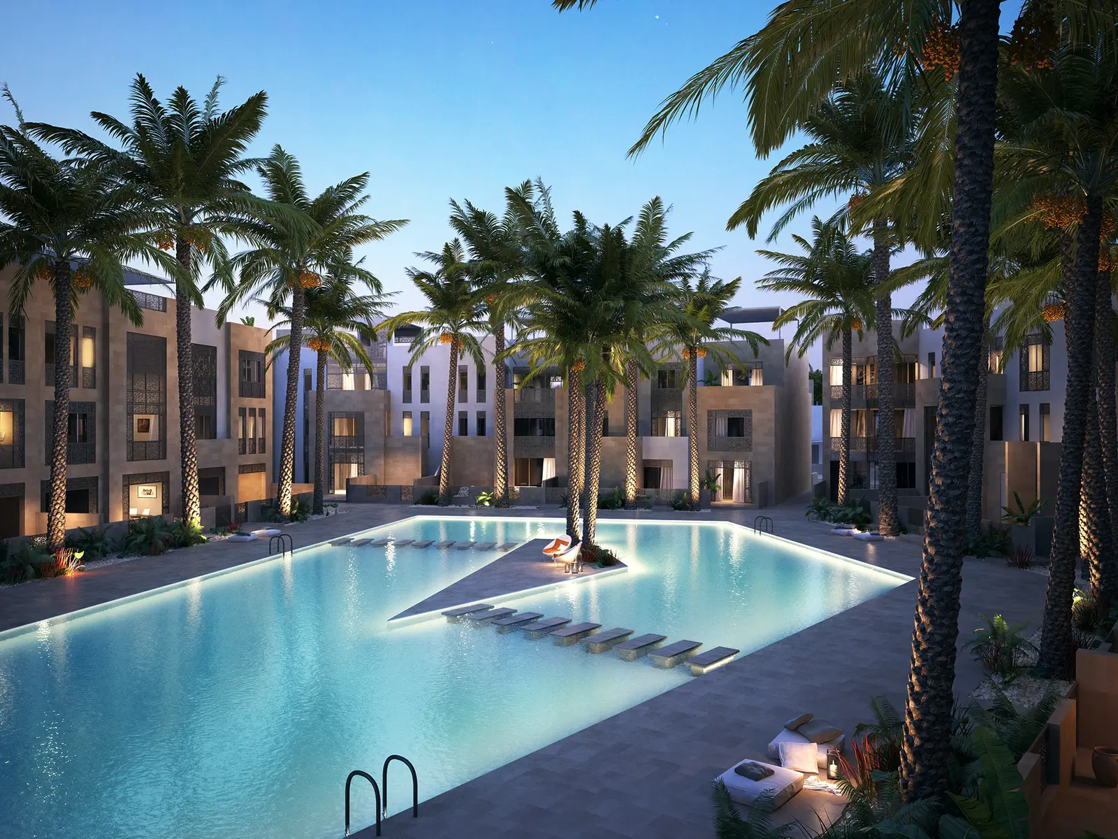 Lit pool at Mangroovy Residences at night